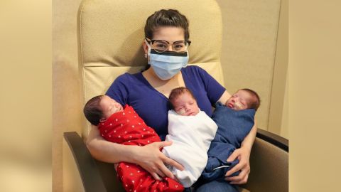 Maggie Sillero holds her triplets, who have almost doubled in size since they were born on June 4.