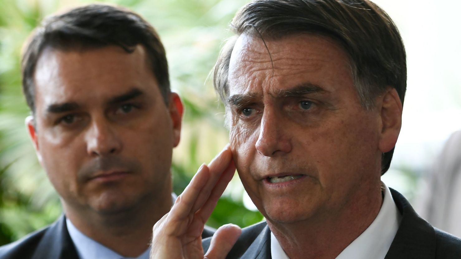 Jair Bolsonaro accompanied by his son Flavio in November 2018.