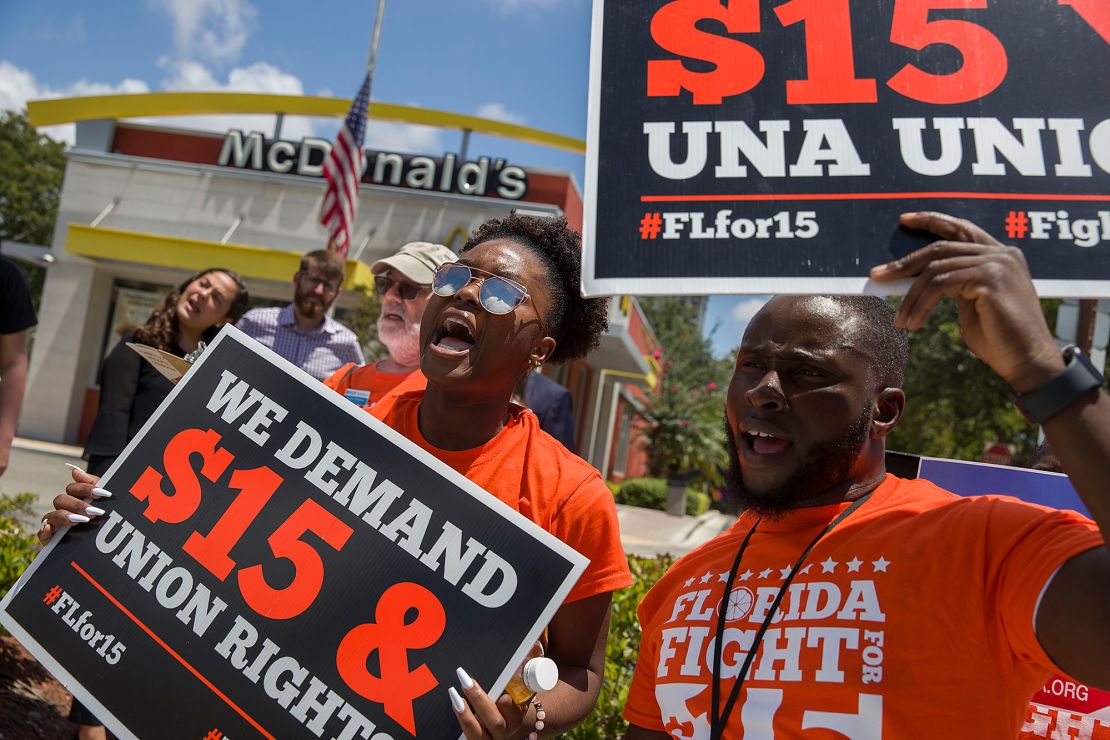 People gather to ask McDonald's to raise workers wages to a $15 minimum wage and demand the right to a union on May 23, 2019 in Fort Lauderdale, Florida.