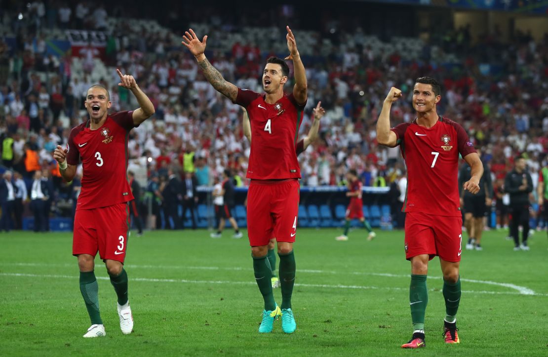 Pepe (left), Jose Fonte and Cristiano Ronaldo (right) celebrate victory over Poland in the quarterfinals of Euro 2016. 