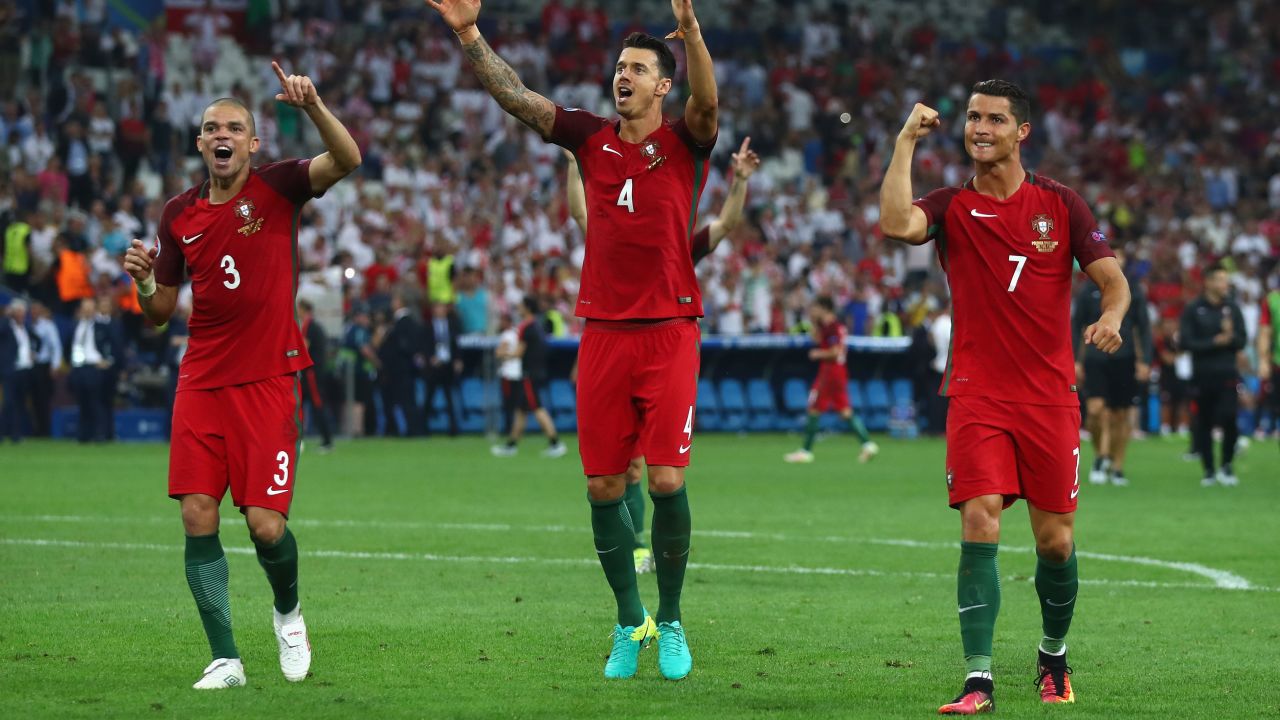 Pepe (left), Jose Fonte and Cristiano Ronaldo (right) celebrate victory over Poland in the quarterfinals of Euro 2016.