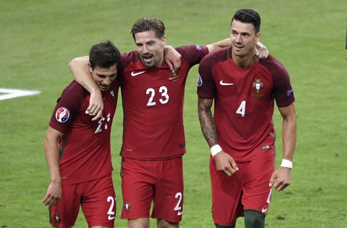 Cedric Soares (left), Adrien Silva and Jose Fonte celebrate victory against France in the Euro 2016 final.