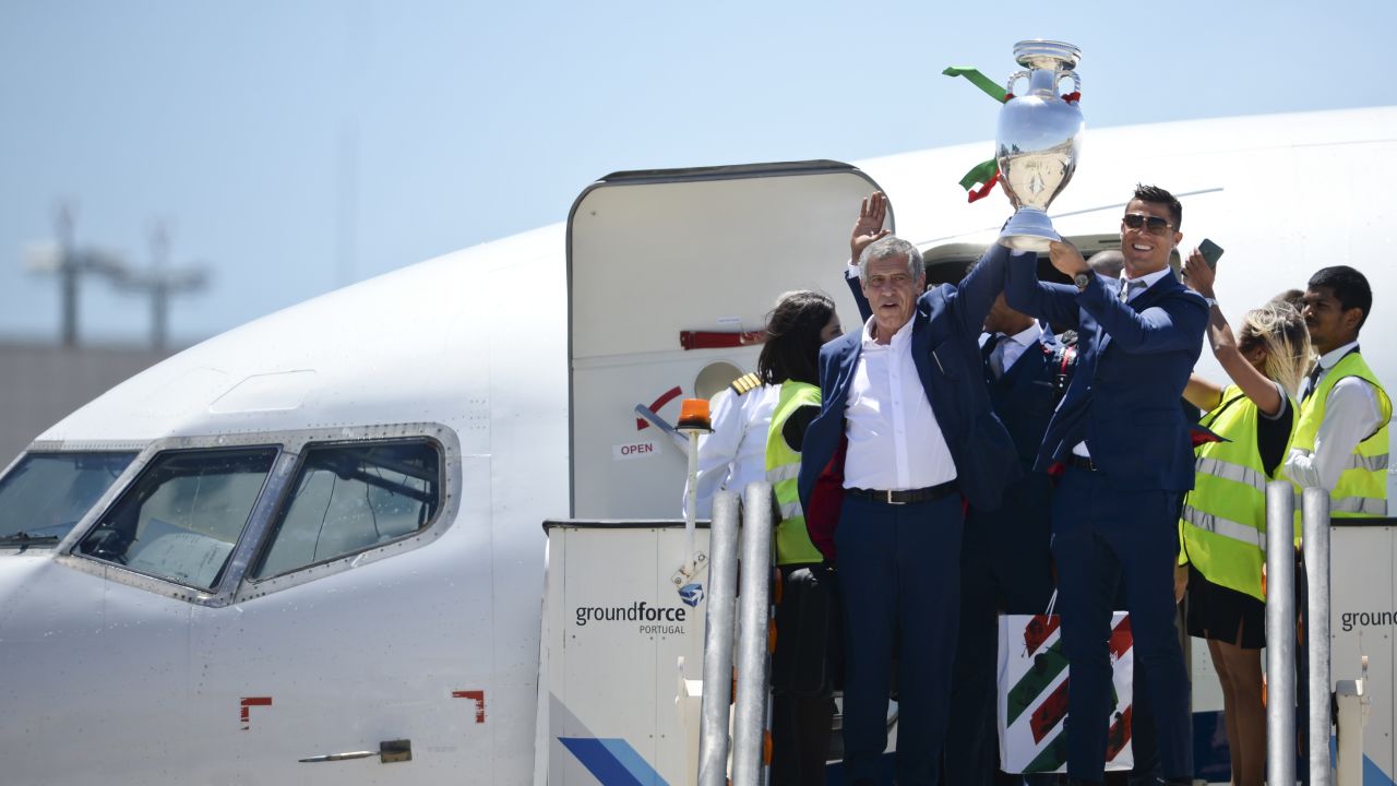 Fernando Santos (left) and Cristiano Ronaldo return to Lisbon with the European championship trophy.