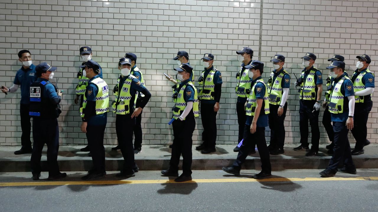 Police officers walk to search for missing Seoul Mayor Park Won-soon in Seoul, South Korea, on July 9, 2020. 