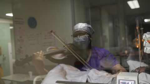 Chilean nurse Damaris Silva plays the violin for patients in Santiago, Chile.