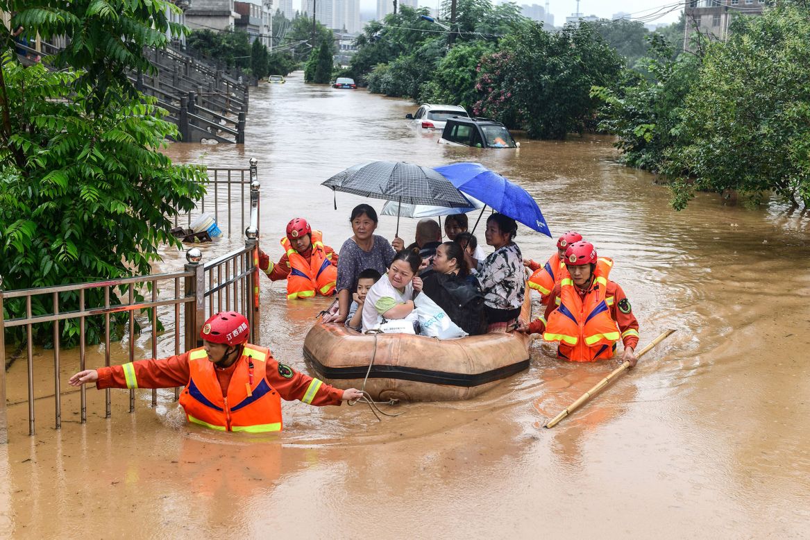 People are rescued after flooding in Jiujiang, China, on Wednesday, July 8.