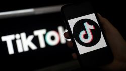In this photo illustration, the social media application logo, TikTok is displayed on the screen of an iPhone on April 13, 2020, in Arlington, Virginia - TikTok has pledged $250 million to local organizations around the world supporting healthcare, education, and struggling communities impacted by the coronavirus pandemic. (Photo by Olivier DOULIERY / AFP) (Photo by OLIVIER DOULIERY/AFP via Getty Images)