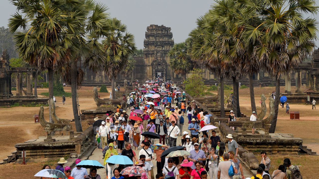 Tourists visit the Angkor Wat temple in Siem Reap province on March 16, 2019.