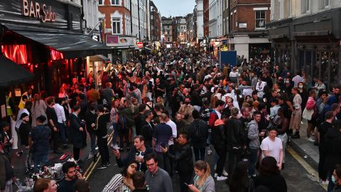 Revellers pack a street outside bars in the Soho area of London on July 4, as restrictions are further eased.