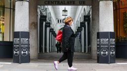 A pedestrian wearing a protective face mask passes an entrance to Covent Garden Market in London, U.K., on Saturday, July 4, 2020. Restaurants, hotels, cinemas and hairdressers will also be allowed to open their doors again on what has been dubbed 'Super Saturday' after 3 1/2 months of an economic lockdown brought in to contain the outbreak. Photographer: Simon Dawson/Bloomberg via Getty Images