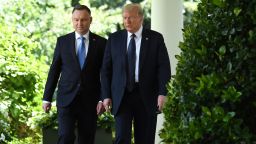 US President Donald Trump and Polish President Andrzej Duda(L) walk before a holding a joint press conference in the Rose Garden of the White House in Washington, DC, June 24, 2020. 
