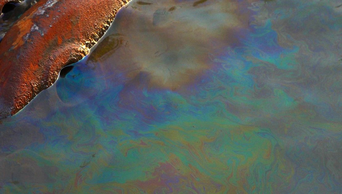 A layer of gasoline visible on the  surface of the Daldykan River.