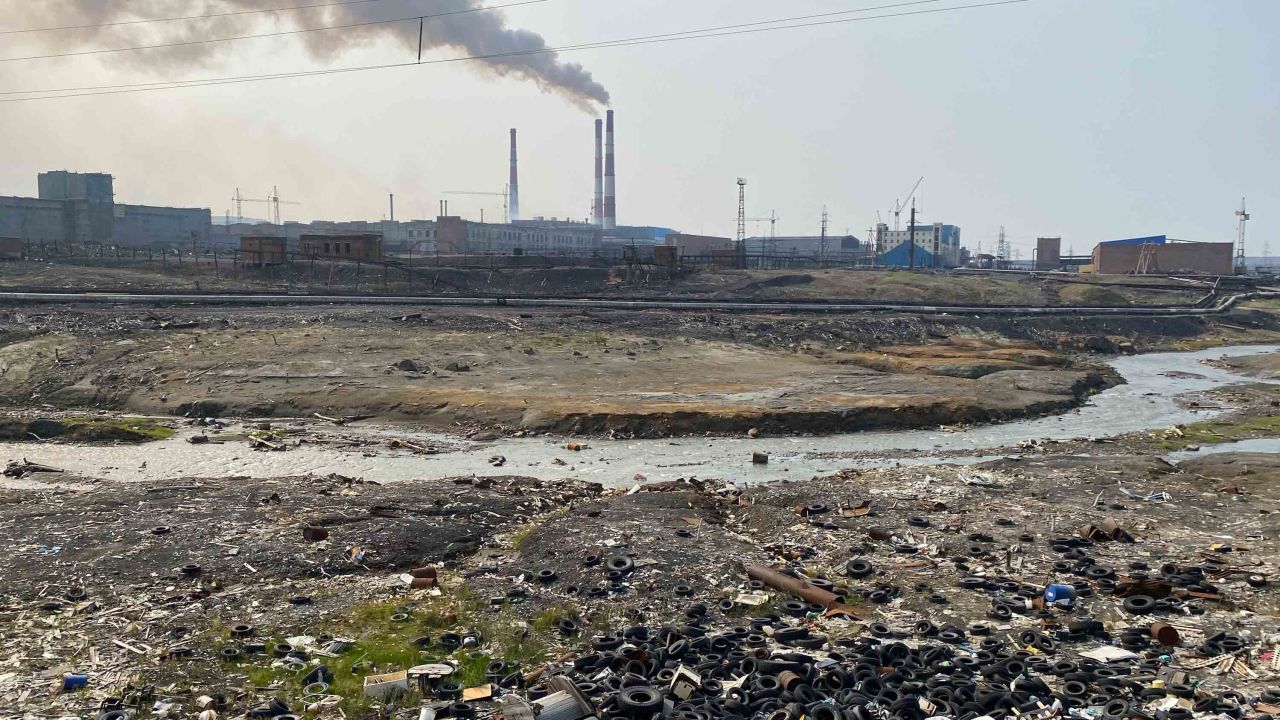A dump on the river bank next to an pre-processing plant on the outskirts of Norilsk. 