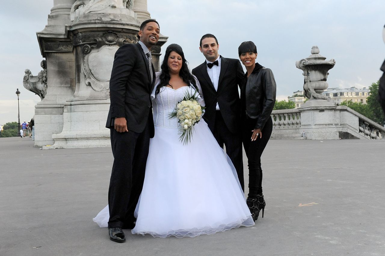 Will and Jada were going to a movie premiere in 2010 when they walked by a couple taking wedding photos in Paris. They stopped to pose with the bride and groom.