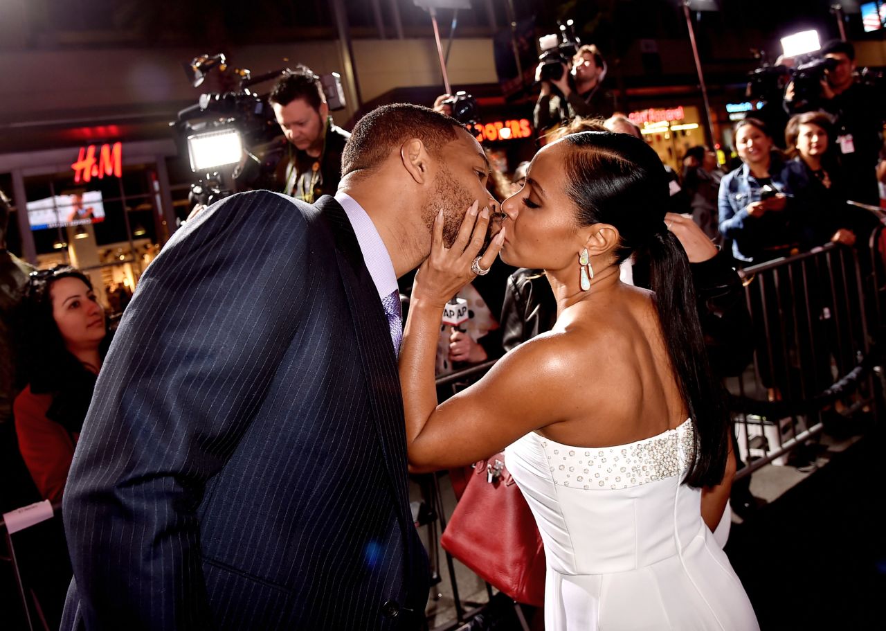 Will and Jada kiss at the "Focus" premiere in February 2015.