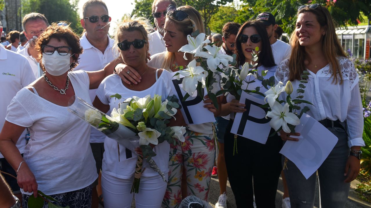 Veronique Monguillot, second left, mourns the death of her late husband Philippe on July 8 in Bayonne. 