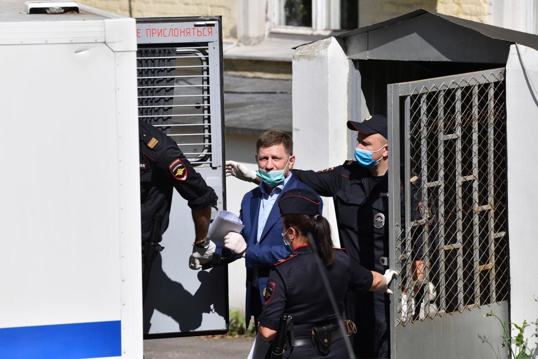 Khabarovsk Governor Sergey Furgal is escorted into a police van after a court hearing in Moscow on Friday.