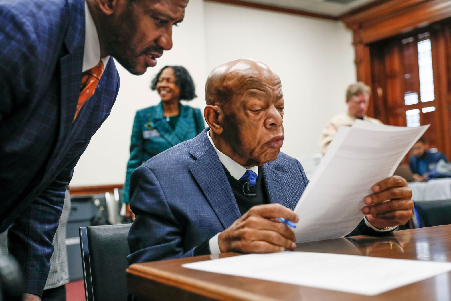 Lewis reads paperwork about election qualification in March 2020.