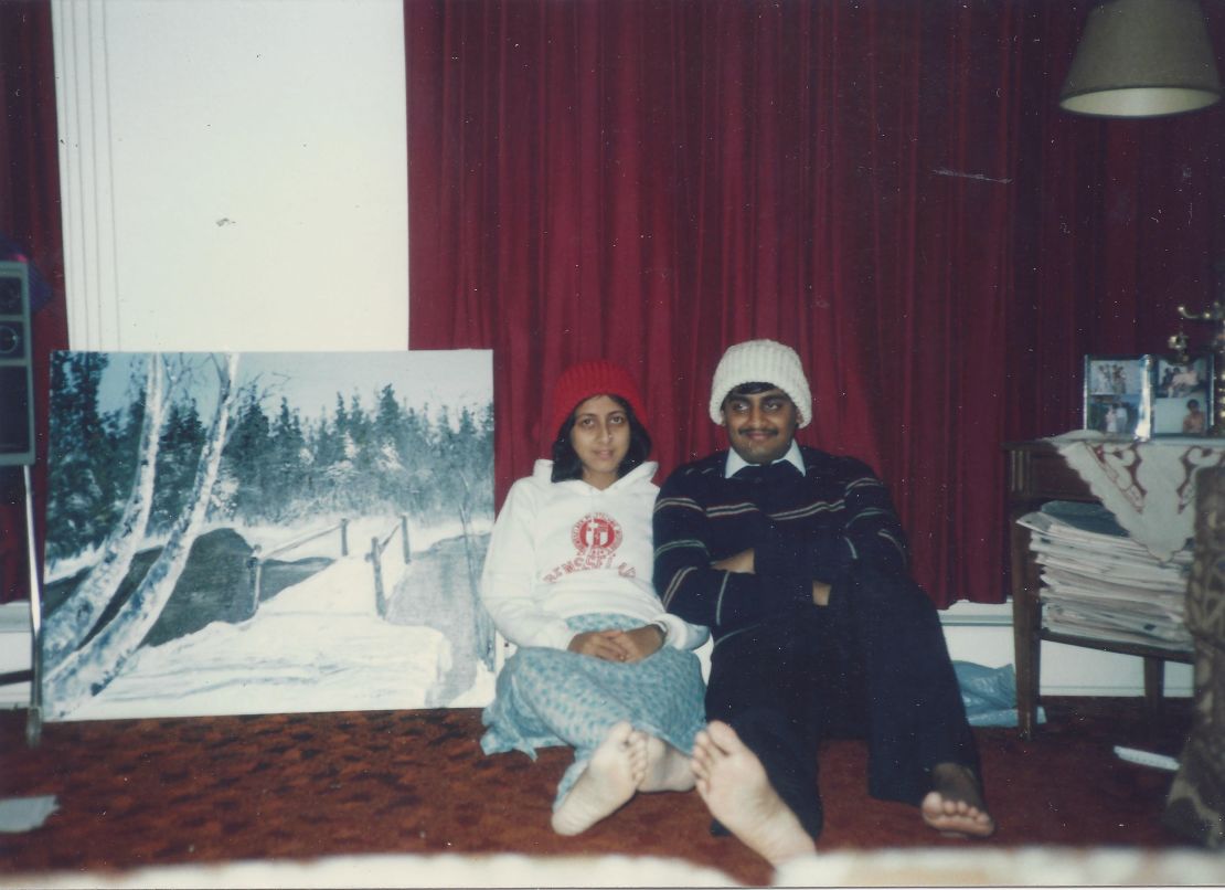 My parents at their first home in the US in 1986, wearing hats my mom knitted.