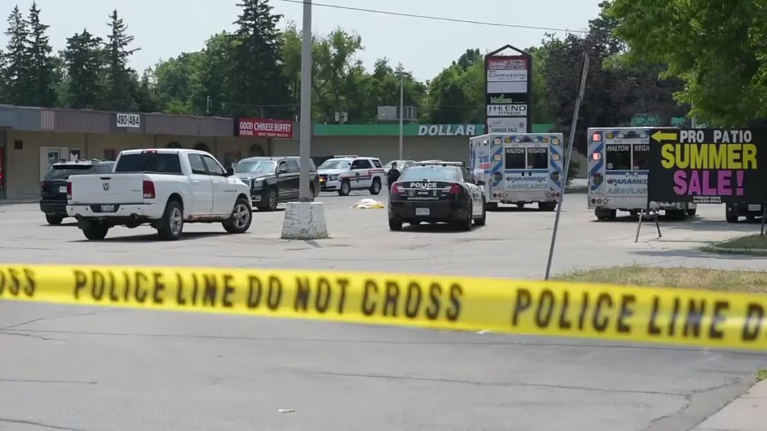 The crime scene outside a commercial plaza in a suburb of Toronto, Canada.