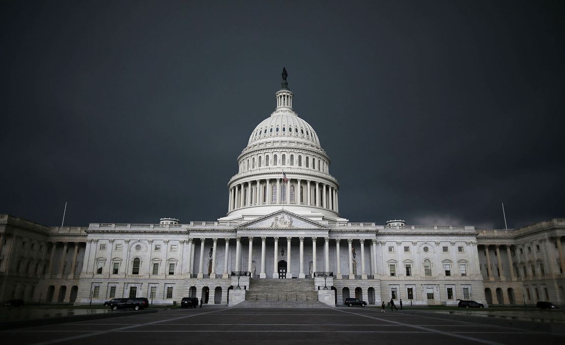 Storm clouds fill the sky over the US Capitol Building.