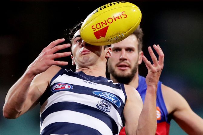 Sam Simpson of the Geelong Cats handles the ball during an AFL match against the Brisbane Lions at Sydney Cricket Ground in Sydney, Australia, on July 9.