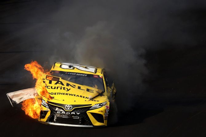 Erik Jones' car catches fire during the NASCAR Cup Series Big Machine Hand Sanitizer 400 at Indianapolis Motor Speedway on July 5.