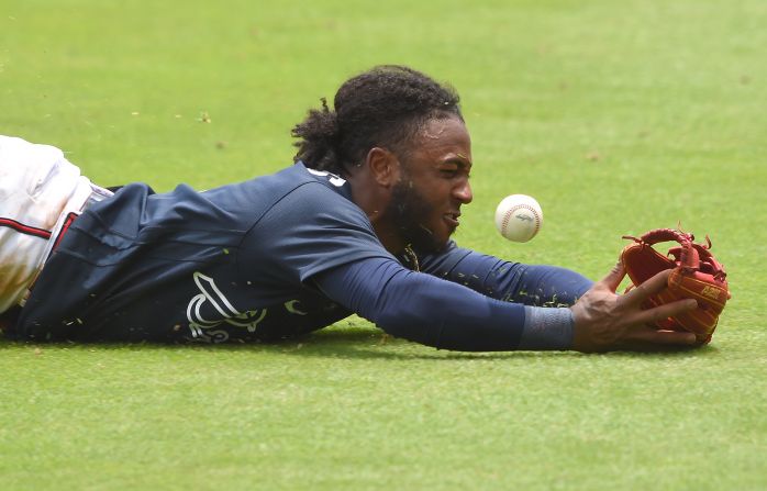 Atlanta Braves second baseman Ozzie Albies tries to make a diving catch during a simulation game at Truist Park in Atlanta on July 8.
