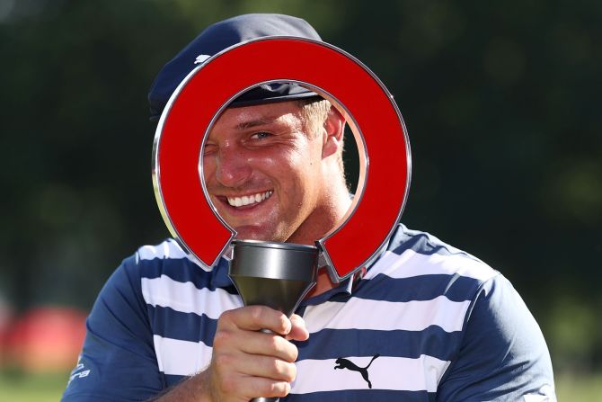 Bryson DeChambeau celebrates with his trophy after winning the Rocket Mortgage Classic golf tournament in Detroit, Michigan, on July 5.