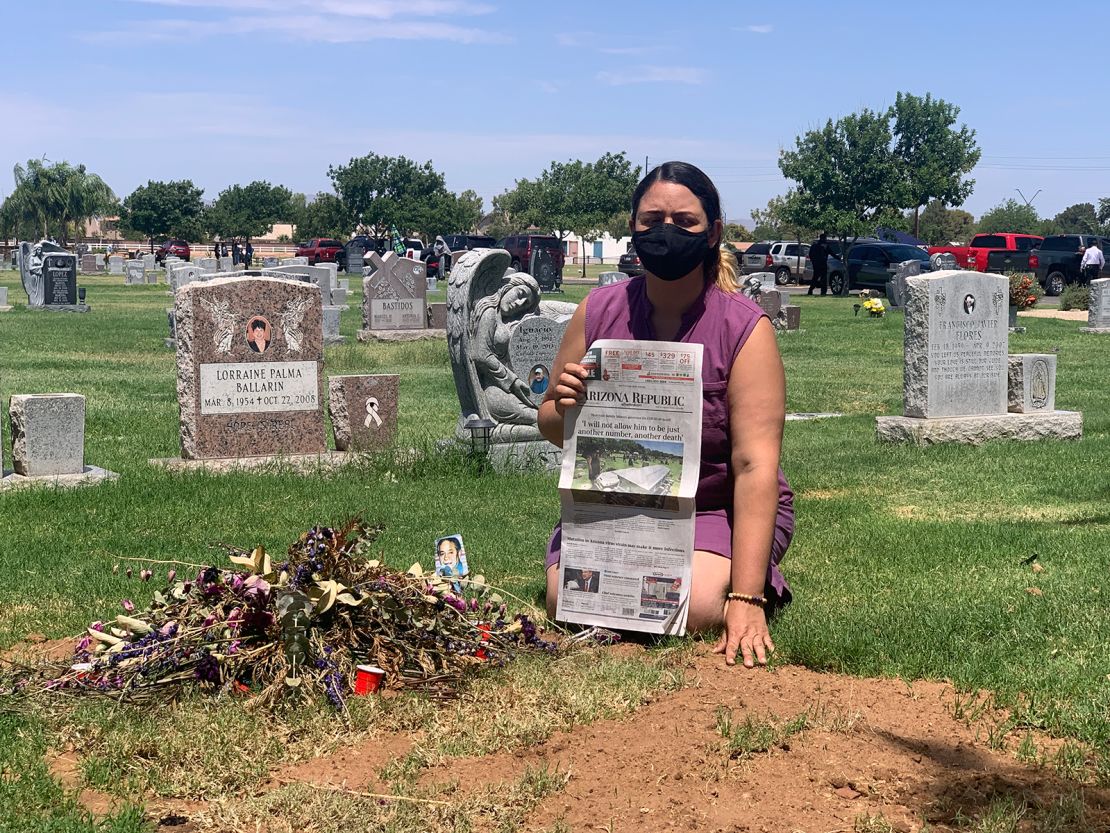 Kristin Urquiza hold her father's obituary over his grave.