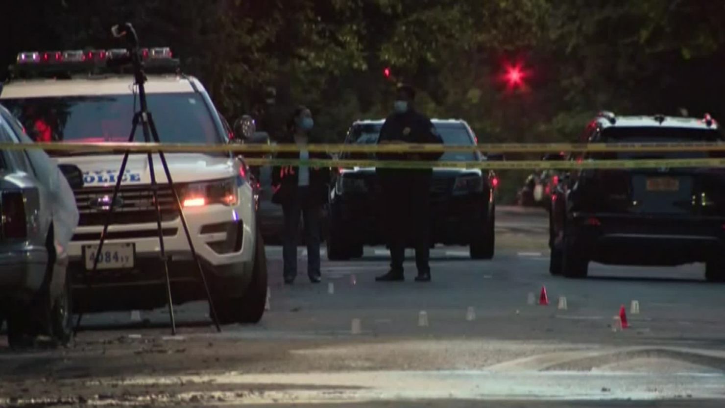 Police respond to the scene of the shooting near a New  York City park on Sunday.