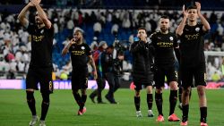 Mnachester City's players celebrate their win at the end of the UEFA Champions League round of 16 first-leg football match between Real Madrid CF and Manchester City at the Santiago Bernabeu stadium in Madrid on February 26, 2020. (Photo by JAVIER SORIANO / AFP) (Photo by JAVIER SORIANO/AFP via Getty Images)