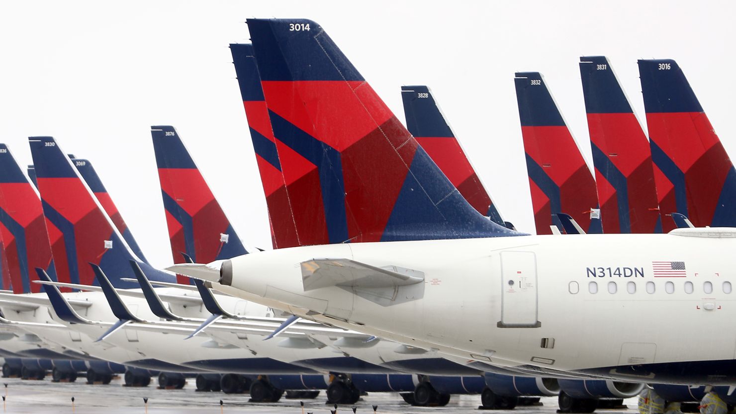 Planes belonging to Delta Airlines sit idle at Kansas City International Airport on April 03, 2020 in Kansas City, Missouri. U.S. carriers reported an enormous drop in bookings amid the spread of the coronavirus and are waiting for a government bailout to fight the impact. Delta lost almost $2 billion in March and parked half of its fleet in order to save money. (Photo by Jamie Squire/Getty Images)
