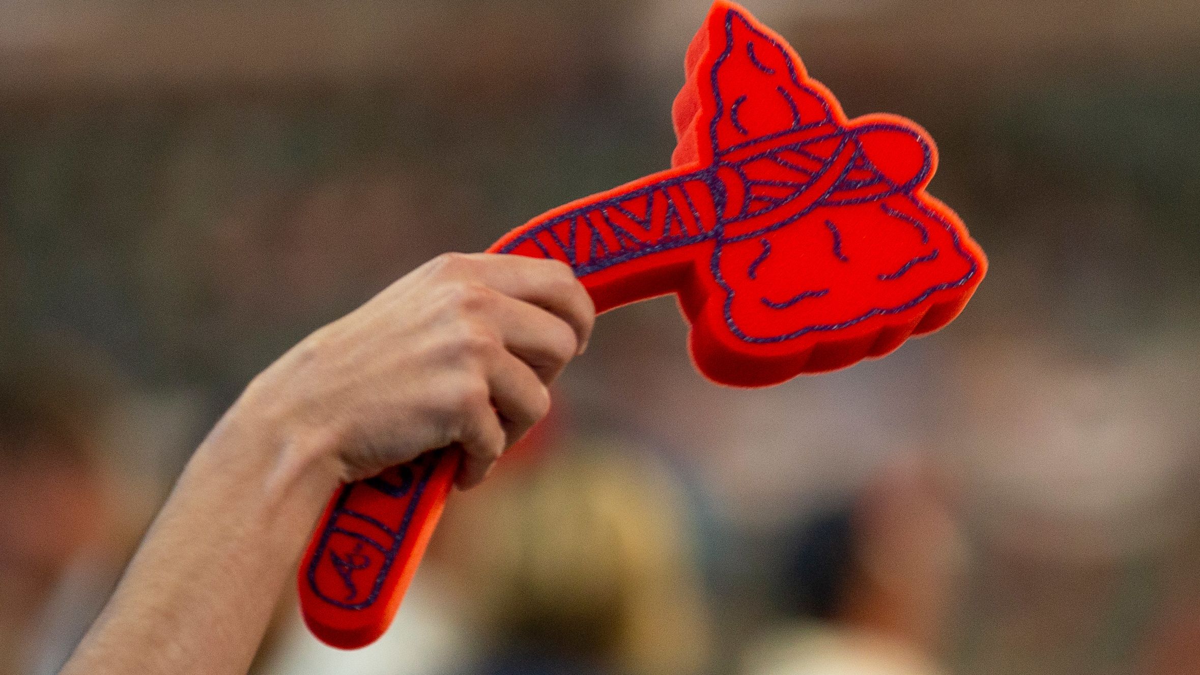 A fan holds a foam tomahawk during Game Five of the National League Division Series between the Atlanta Braves and the St. Louis Cardinals at SunTrust Park on October 9, 2019 in Atlanta.