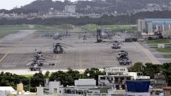 (FILES) This file photo taken on June 22, 2005 shows US helicopters and planes parked at Futenma US Marine Base in Ginowan, Okinawa Prefecture.  The United States said on November 3, 2009 its top diplomat for Asia would visit Tokyo later in the week to pursue an "intense dialogue" with Japan's new center-left government amid a row over an air base. Many Okinawans oppose the US presence and want the controversial US Marine Corps Futenma Air Base closed and moved off the island, rather than having it relocated to the coastal Camp Schwab site as previously agreed.    AFP PHOTO / FILES / Toru YAMANAKA (Photo credit should read TORU YAMANAKA/AFP via Getty Images)
