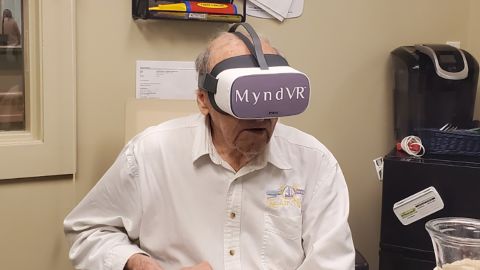 Richard Merrill using the MyndVR virtual reality system. 