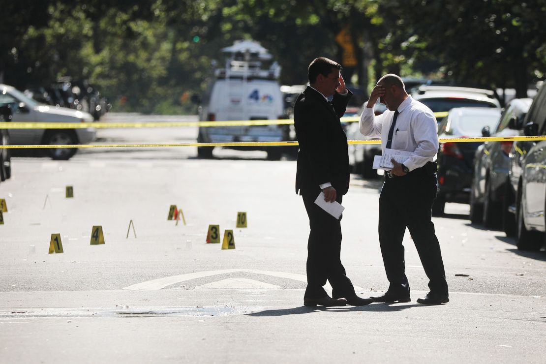 Police work a crime scene in Brooklyn where a 1-year-old boy was killed July 13 when gunfire erupted at a family picnic. 