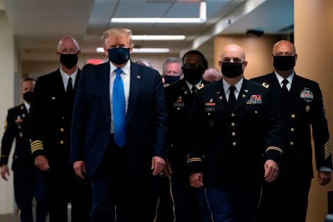 US President Donald Trump wears a face mask <a href="https://www.cnn.com/2020/07/11/politics/trump-walter-reed-visit-mask/index.html" target="_blank">as he visits Walter Reed National Military Medical Center</a> in Bethesda, Maryland, on July 11. This was the first time since the pandemic began that the White House press corps got a glimpse of Trump with a face covering.