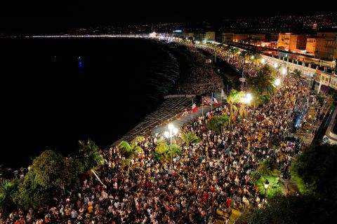 People gather on the Baie des Anges to hear the set of French DJ The Avener during a concert in Nice, France, on July 11. It was the first public show in Nice since France ended its coronavirus shutdown.