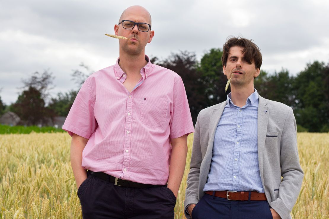 Ive De Smet (left) and David Vergauwen (right) stand in a field of wheat, one species that has been the focus of this type of research.