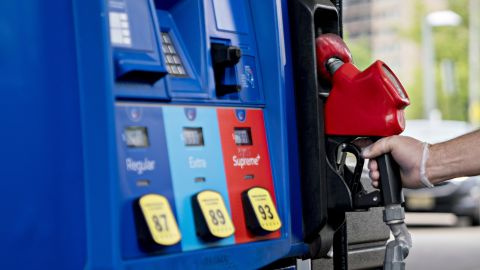 A customer wearing a protective glove returns a fuel nozzle after refueling at an Exxon Mobil Corp. gas station in Arlington, Virginia, U.S., on Wednesday, April 29, 2020. Exxon is scheduled to released earnings figures on May 1. Photographer: Andrew Harrer/Bloomberg via Getty Images