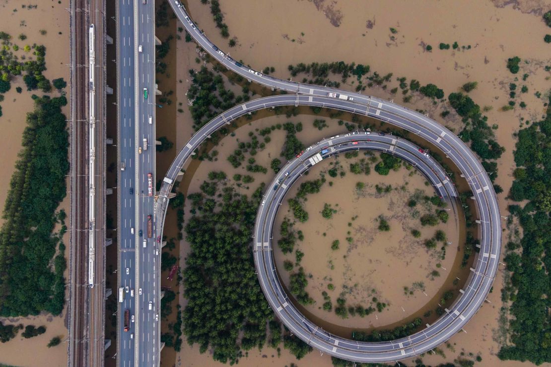 This aerial view shows a bridge leading to the inundated Tianxingzhou island in Wuhan in China's central Hubei province on July 13.