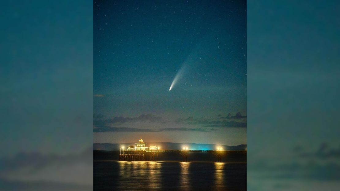 The comet is captured on Sunday at Clevedon Pier, England, by Jon Rees.