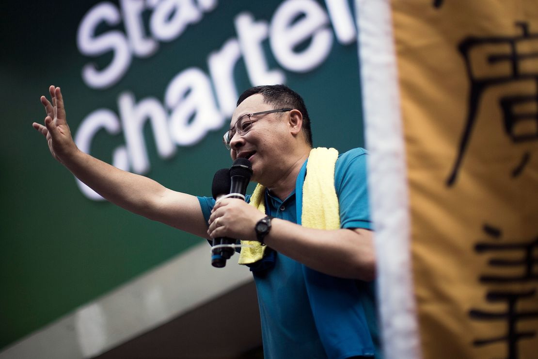 Hong Kong activist and protest leader Benny Tai waves to the crowd during a rally in July 2015.
