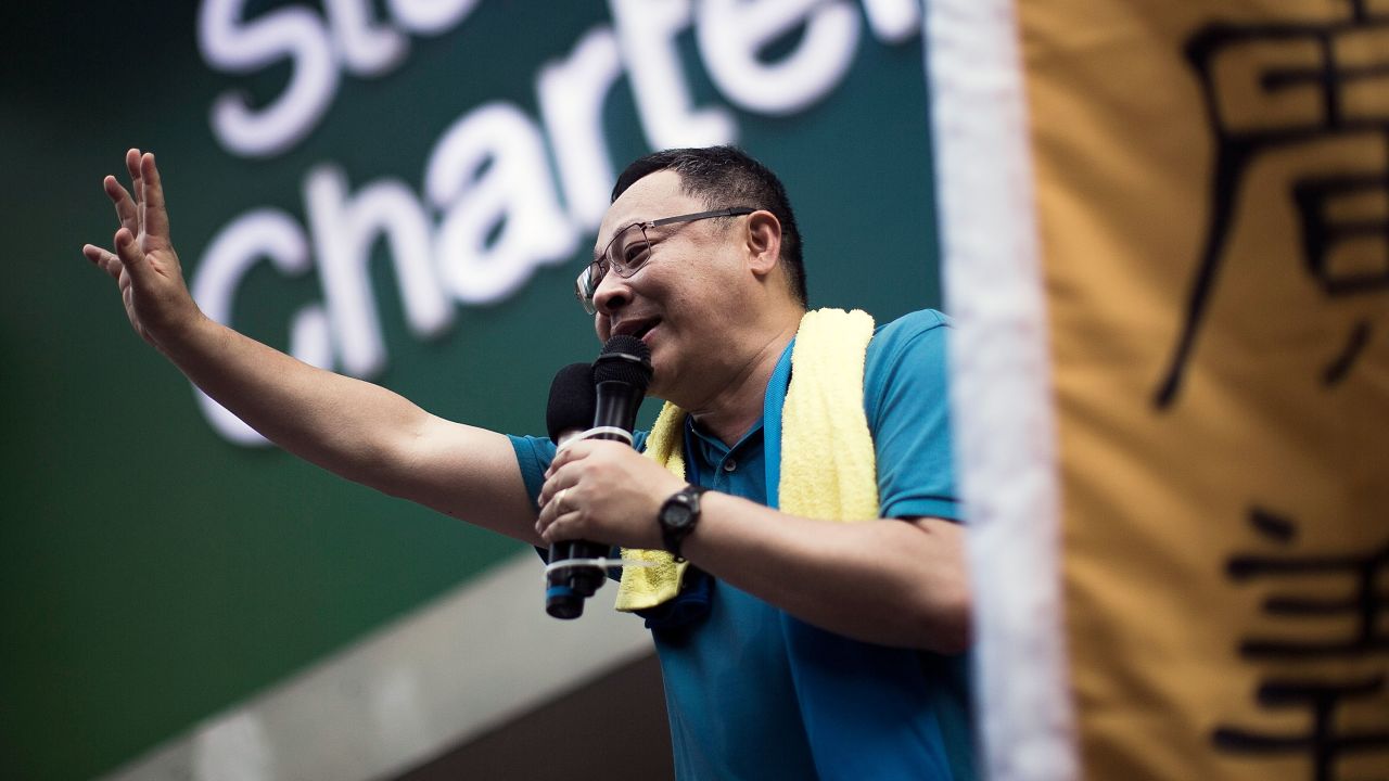 Hong Kong activist and protest leader Benny Tai waves to the crowd during a rally in July 2015.