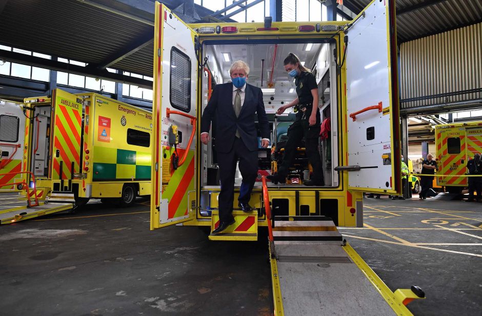 British Prime Minister Boris Johnson talks with a paramedic during his visit to the headquarters of the London Ambulance Service NHS Trust on July 13. <a href="https://www.cnn.com/2020/07/14/uk/uk-masks-shops-winter-predictions-intl-scli-gbr/index.html" target="_blank">Wearing face masks</a> in shops and supermarkets in England will be compulsory from July 24. The United Kingdom is one of the countries worst hit by coronavirus. Its fatalities trail only Brazil and the United States.