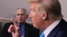 Anthony Fauci, director of the National Institute of Allergy and Infectious Diseases, listens to U.S. President Donald Trump speak to reporters following a meeting of the coronavirus task force at the White House on April 7, 2020 in Washington, DC. 