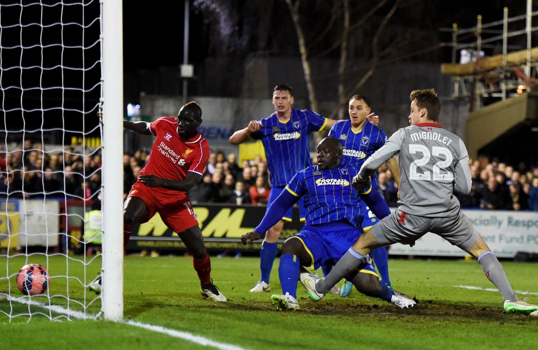 Akinfenwa scores for AFC Wimbledon against Liverpool in the FA Cup in 2015.