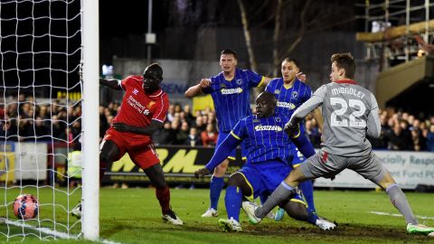 Akinfenwa scores for AFC Wimbledon against Liverpool in the FA Cup in 2015.