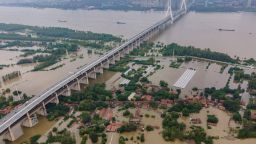 This aerial view shows the inundated Tianxingzhou island, which is set to be a flood flowing zone to relieve pressure from the high level of water in Yangtze River, in Wuhan in China's central Hubei province on July 13, 2020. - Various parts of China have been hit by continuous downpours since June, with the damage adding pressure to a domestic economy already hit by the coronavirus pandemic. (Photo by STR / AFP) / China OUT (Photo by STR/AFP via Getty Images)
